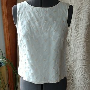 Sleeveless silk top with button back